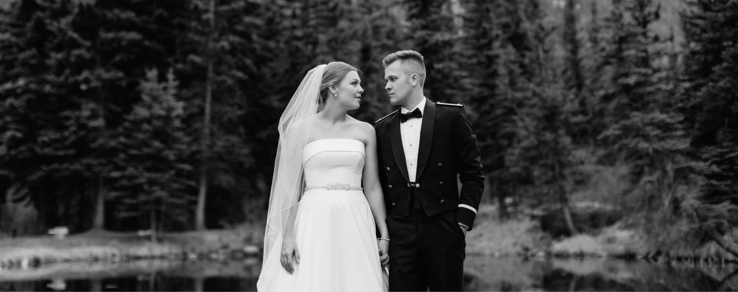 Сouple wearing a white gown and a black suit