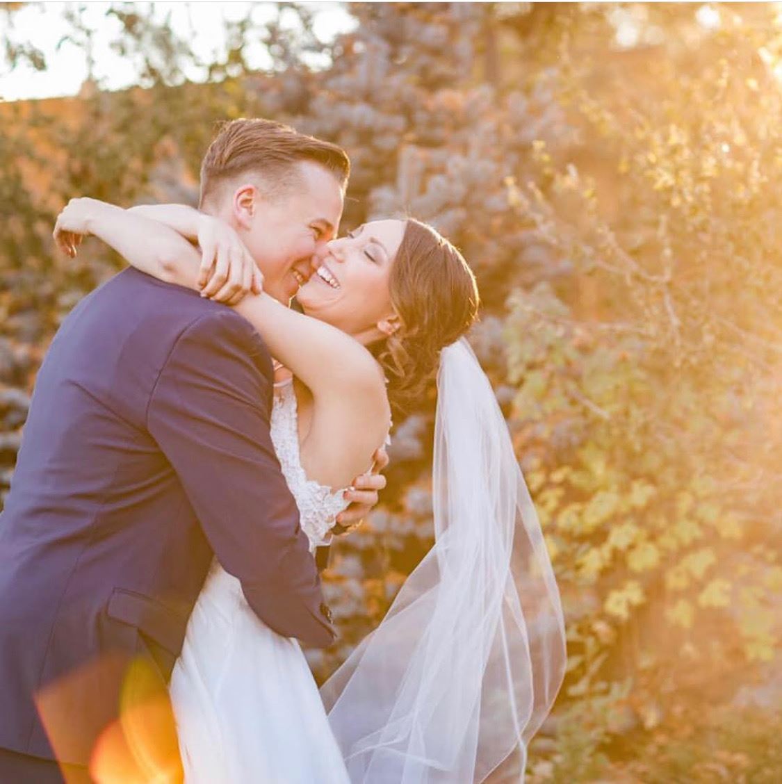 Сouple wearing a white gown and a blue suit