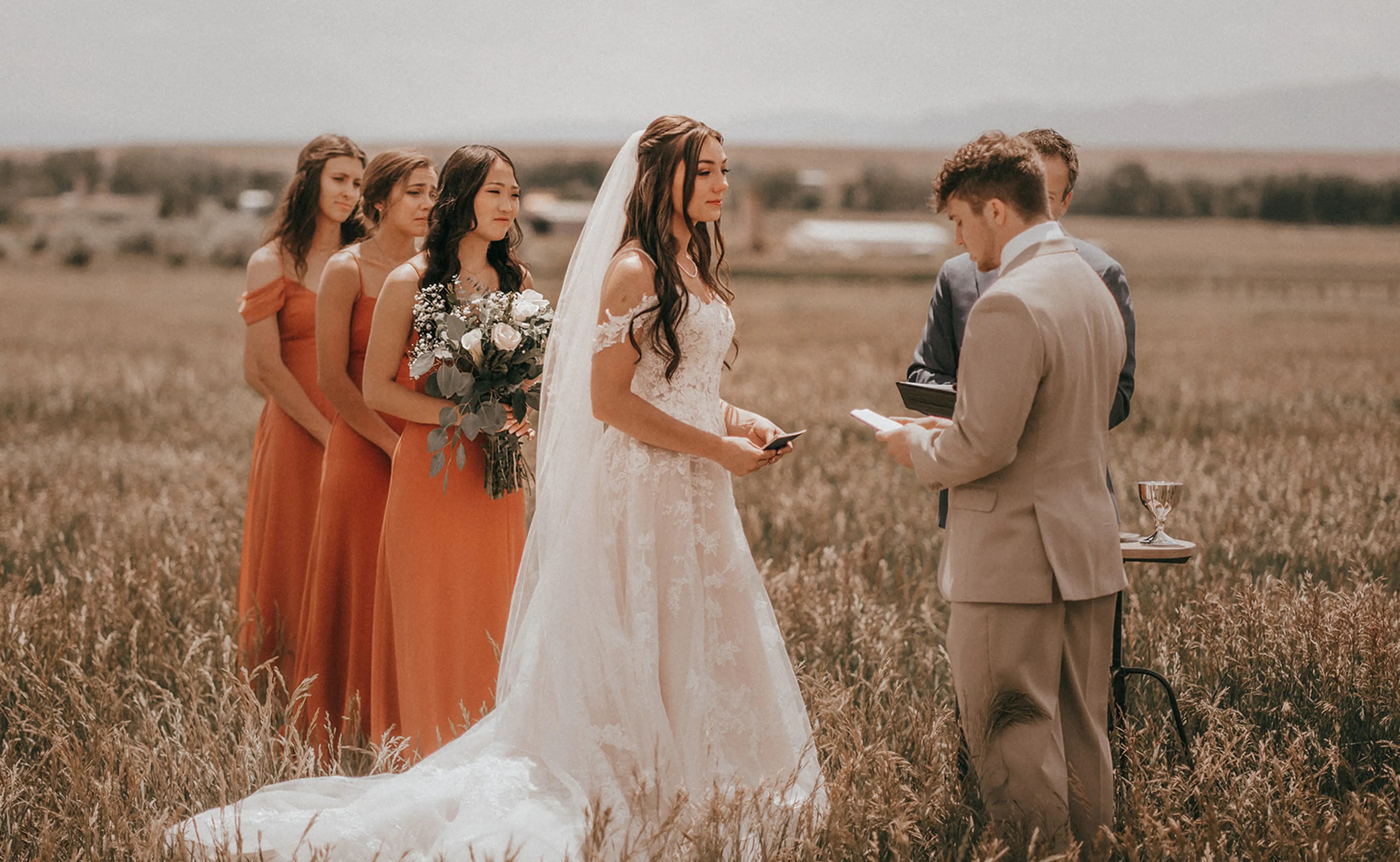 Сouple wearing a white gown and a gray suit