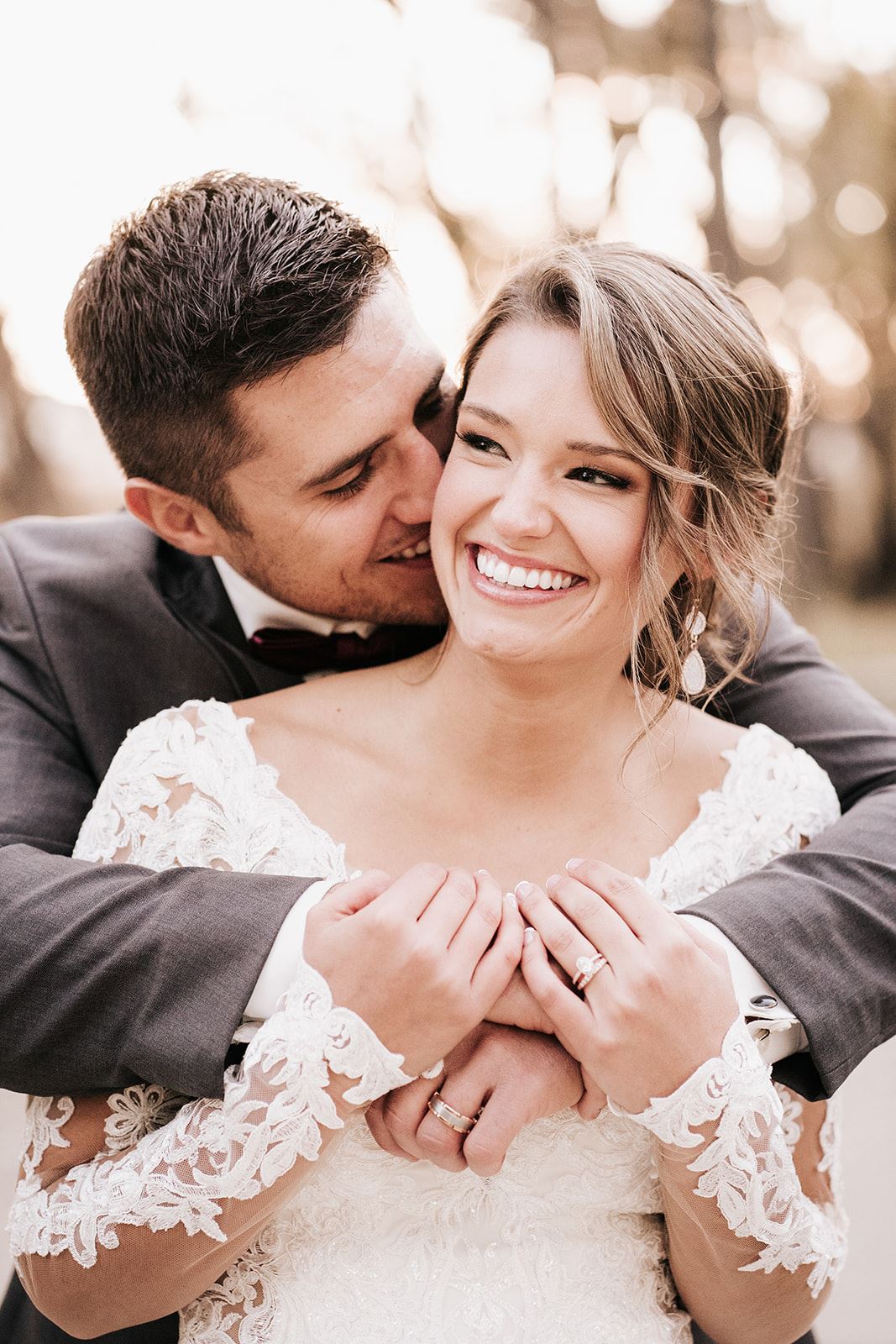 Сouple wearing a white gown and a gray suit