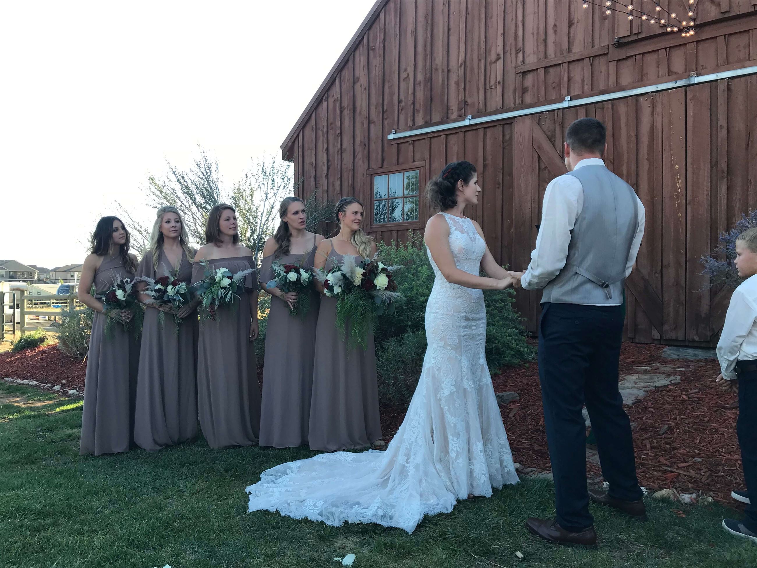 Сouple wearing a white gown and a gray suit