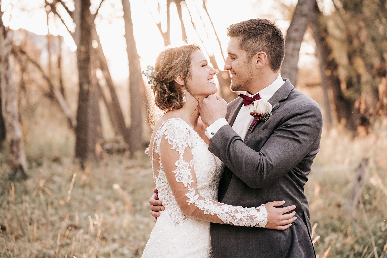 Сouple wearing a white gown and a gray suit