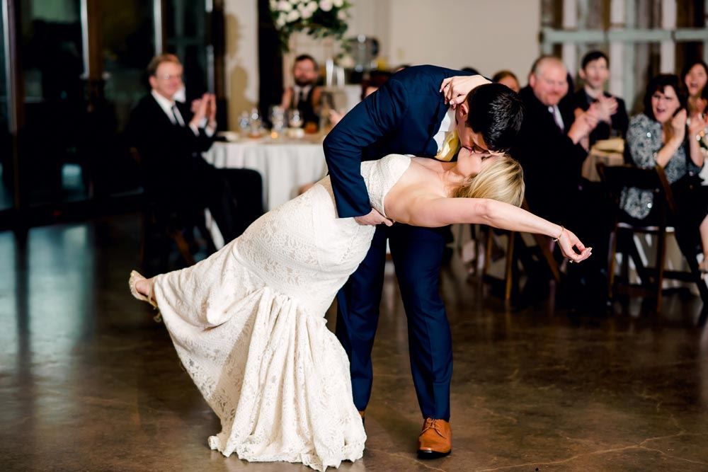 Dancing couple wearing a white gown and a blue suit
