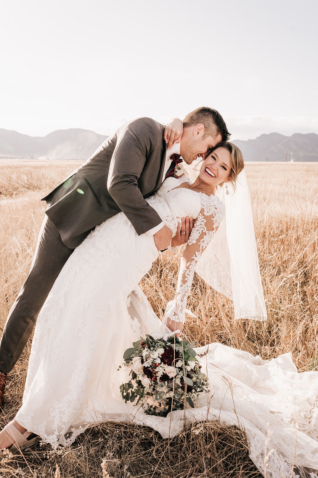 Dancing couple wearing a white gown and a gray suit