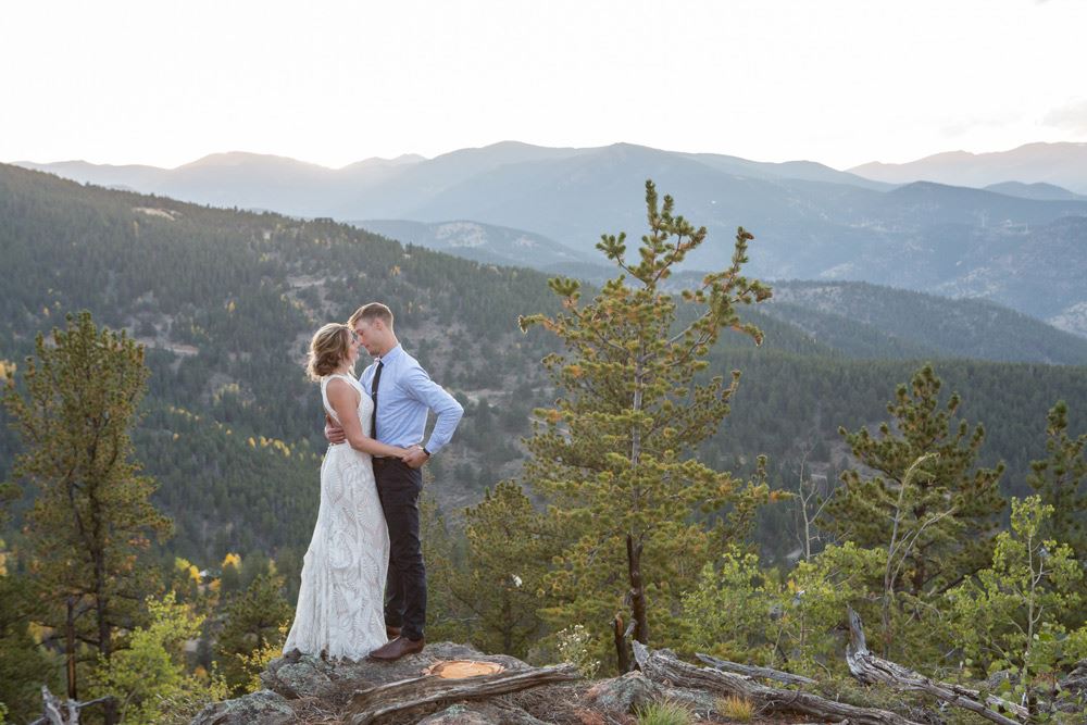 Сouple wearing a white gown and a black suit